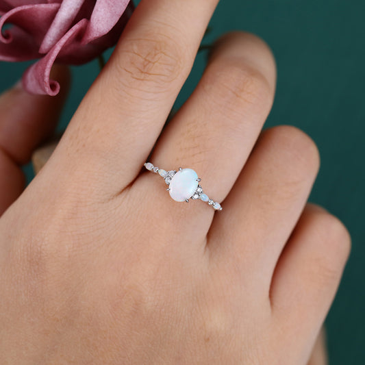 Four-Claw Prong Oval Cut Opal Engagement Ring with Cluster Accents