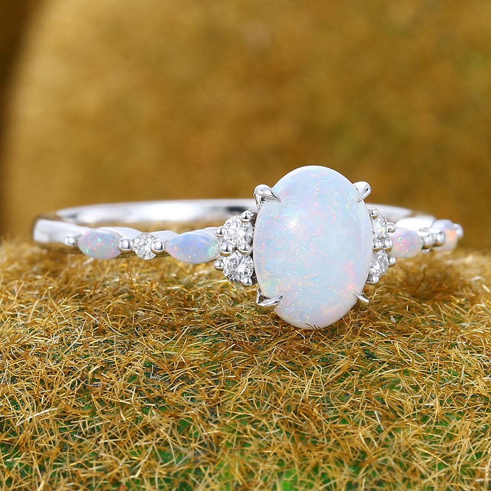 Four-Claw Prong Oval Cut Opal Engagement Ring with Cluster Accents