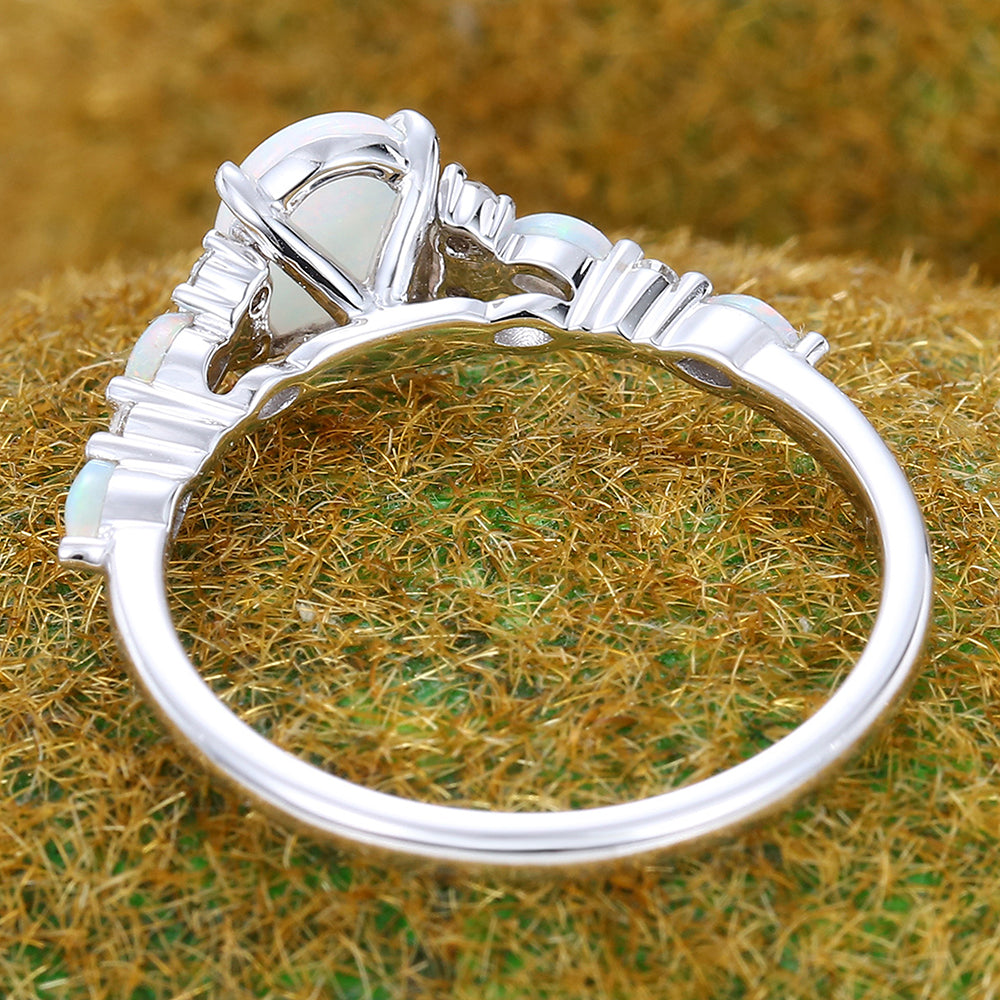 Four-Claw Prong Oval Cut Opal Engagement Ring with Cluster Accents