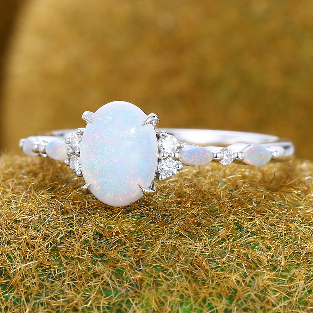 Four-Claw Prong Oval Cut Opal Engagement Ring with Cluster Accents