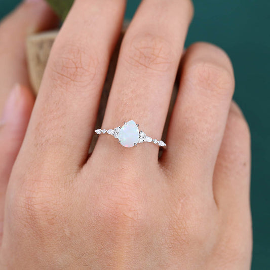 Four-Claw Prong Pear Shaped Opal Engagement Ring with Moissanite Cluster Accents