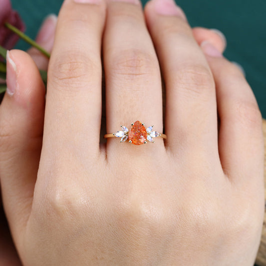 Pear Cut Sunstone Engagement Ring with Moonstone Cluster
