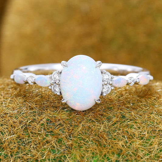Four-Claw Prong Oval Cut Opal Engagement Ring with Cluster Accents
